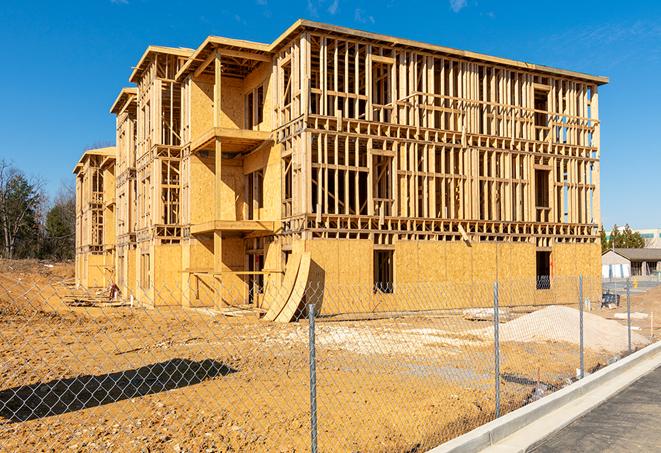 a snapshot of temporary chain link fences protecting a large construction project from unauthorized access in Auburndale